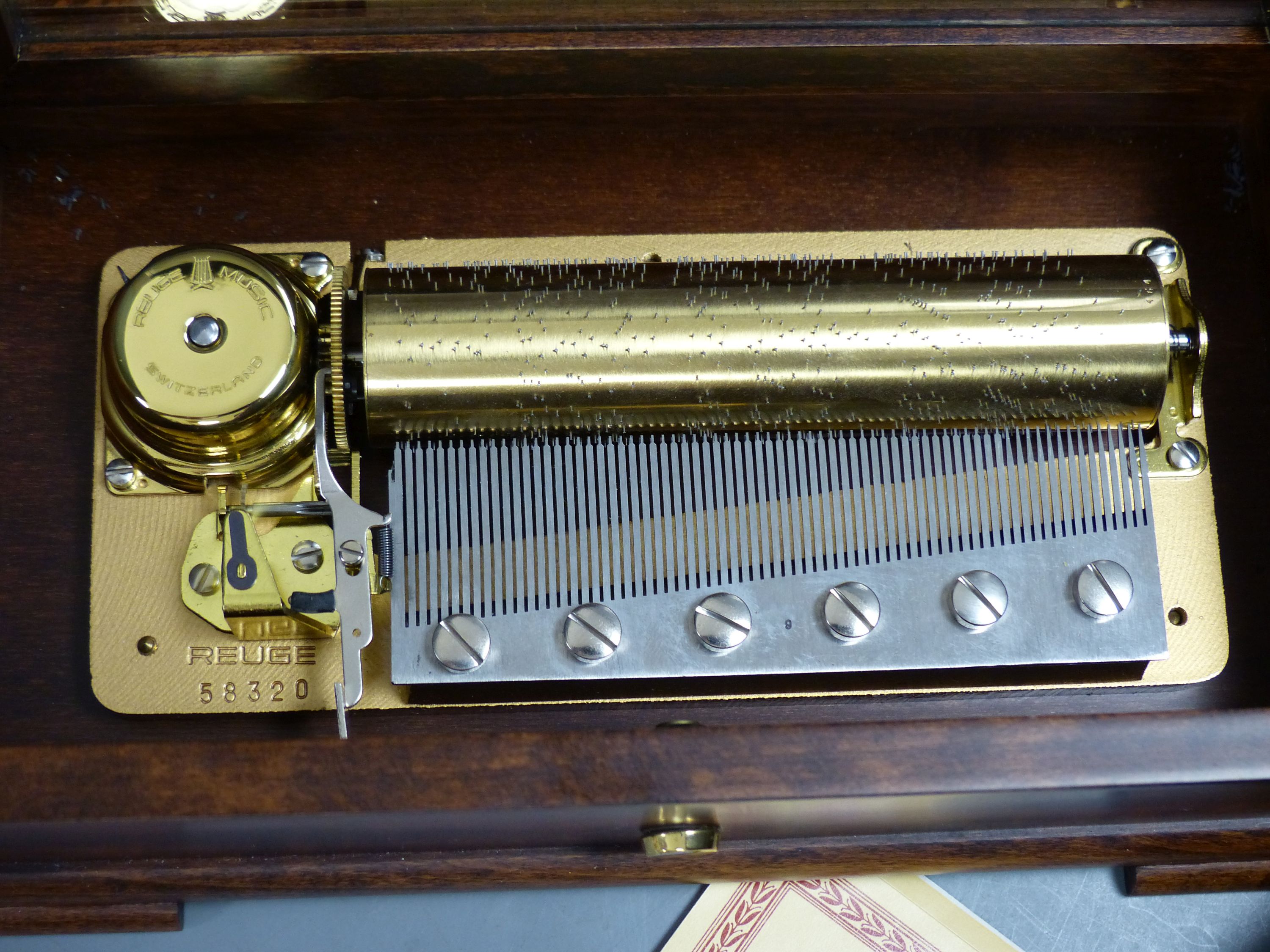 A Swiss Reuge St Croix marquetry and walnut cylinder music box, playing 'The Four Seasons' and a similar small square music box